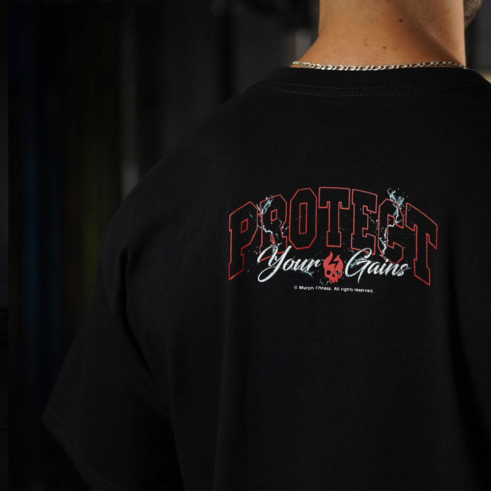 Polera Oversize PROTECT YOUR GAINS - Negro