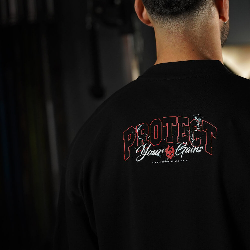 Polera Oversize ICON Premium PROTECT YOUR GAINS - Negro